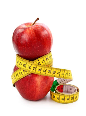  Two red apples and tape measureの写真素材