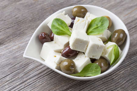 Cubed feta cheese with olivesの写真素材