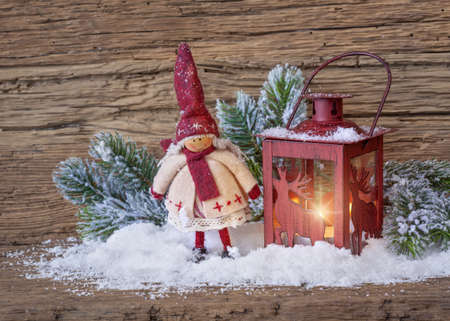 Burning lantern in the snowの写真素材