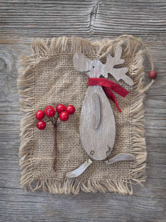 Wooden christmas deer on fabric backgroundの写真素材