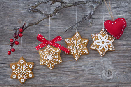 Snowflake gingerbread cookies on wooden backgroundの写真素材