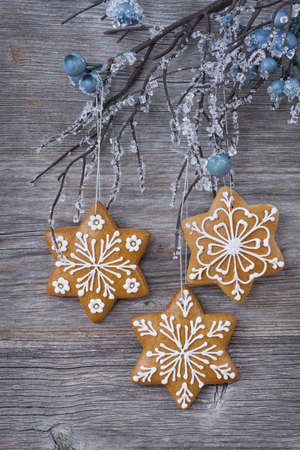 Snowflake gingerbread cookies on wooden backgroundの写真素材