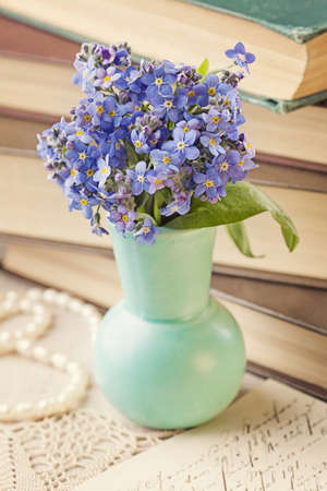 Forget me not flowers and old booksの写真素材