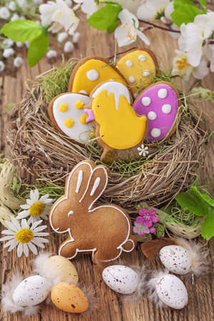 Colorful easter cookies in a nest