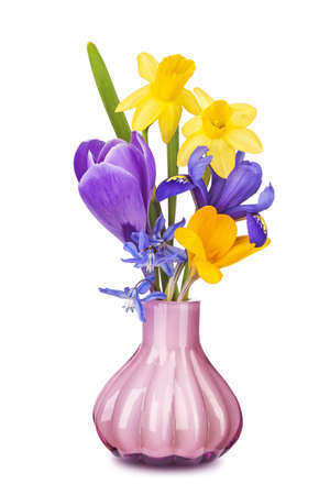 Colorful spring flowers in a vase isolated on white backgroundの写真素材