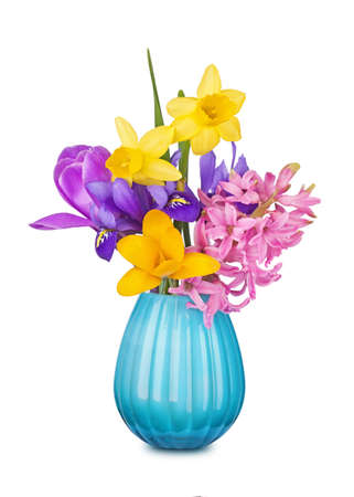 Colorful spring flowers in a vase isolated on white backgroundの写真素材