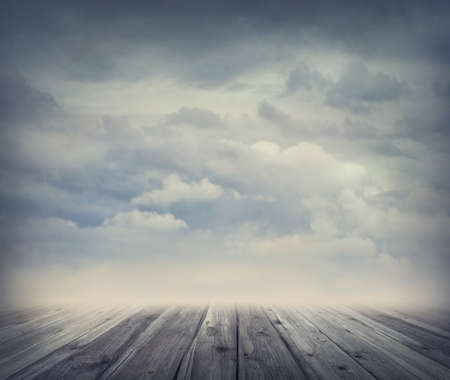 Abstract background with sky and wooden floorの写真素材
