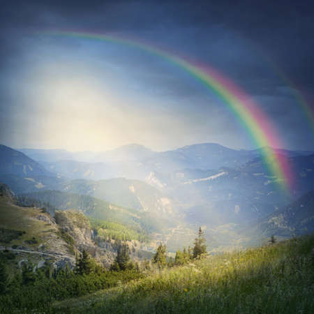 Landscape with rainbow and cloudsの写真素材