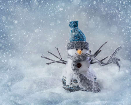 Smiling snowman standing in the snow