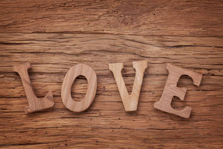 Letters love on wooden backgroundの写真素材