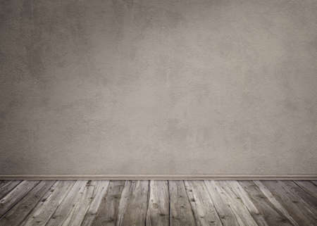 Dark background with a stonewall and wooden floorの写真素材