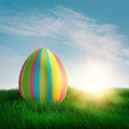 Easter egg in green grassの写真素材