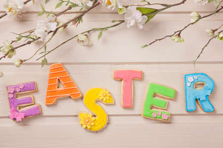 Colorful easter cookies on a wooden background