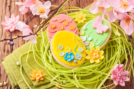 Colorful easter cookies in a nest