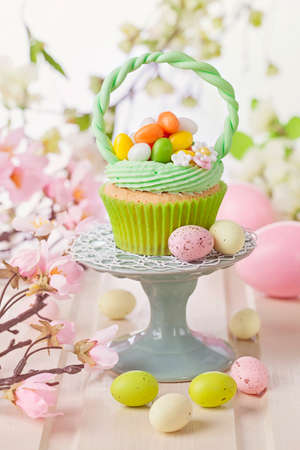 Easter basket cupcake on a stand