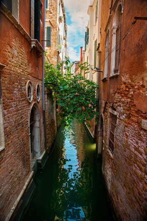 Narrow water canal in Venice, Italyの写真素材