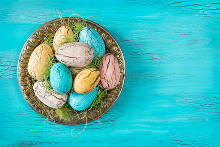 Vintage easter eggs on a blue wooden background