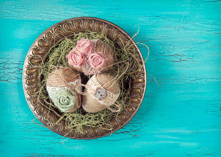 Vintage easter eggs on a blue wooden backgroundの写真素材