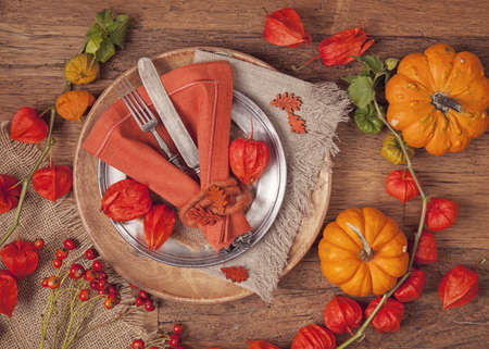 Autumn table setting with knife and forkの写真素材