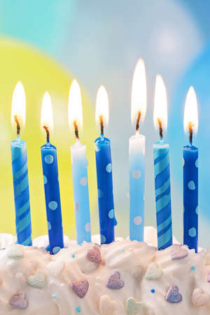 Blue birthday candles and balloonsの写真素材