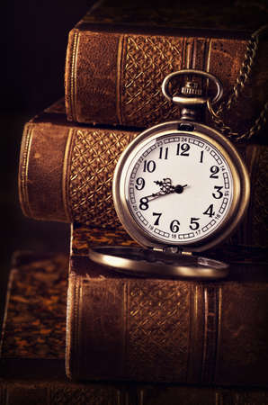 Old vintage books and a watchの写真素材