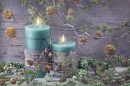 Green christmas candles and decorationの写真素材