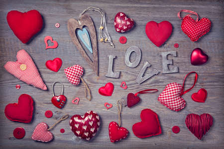 Red hearts on a wooden background