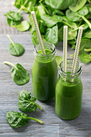 Green smoothie with spinach in glassの写真素材