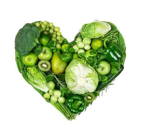 Heart of green fruits and vegetables isolated on a white backgroundの写真素材