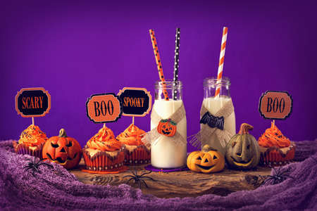 Cupcakes with milk for halloween partyの写真素材