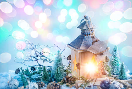 Burning lantern and christmas decoration on white backgroundの写真素材