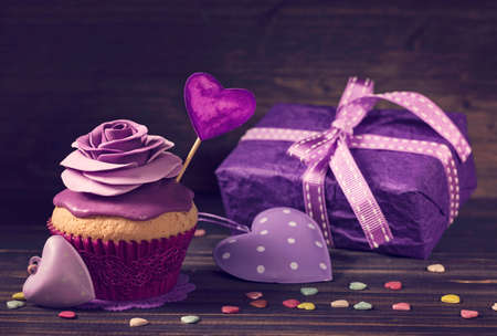 Cupcake with rose and a present for valentine's dayの写真素材