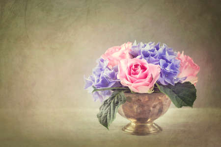 Pastel colored flowers in a vaseの写真素材