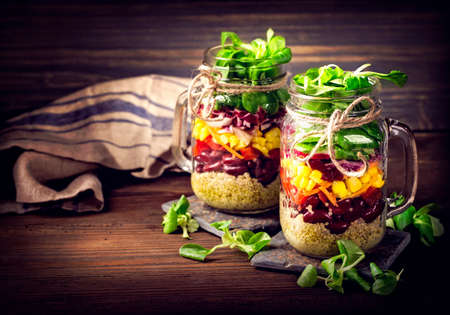 Homemade vegetable salad in a glass jarの写真素材