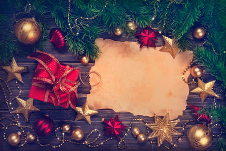 Christmas present and decorations on a wooden backgroundの写真素材