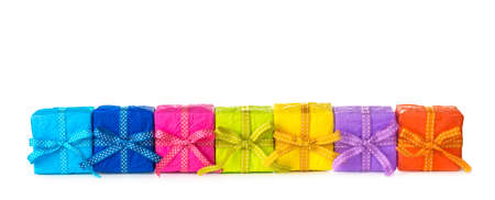 Colorful gift boxes in a row on a white backgroundの写真素材