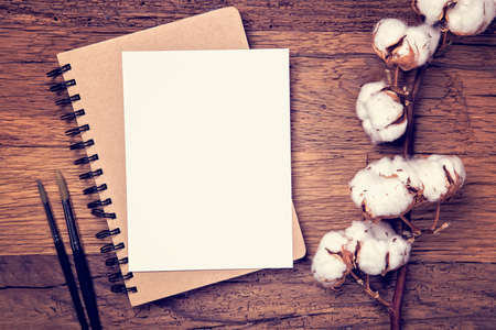 Artistic workplace mock up with brushes and watercolor paperの写真素材