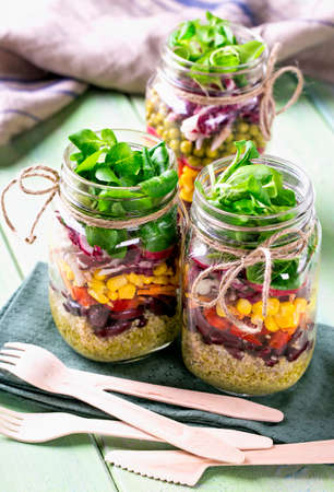 Homemade vegetable salad in a glass jarの写真素材