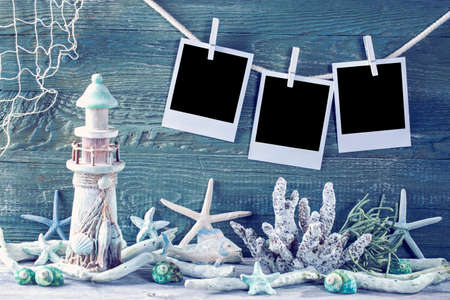 Marine life decoration and  instant photos on blue shabby backgroundの写真素材