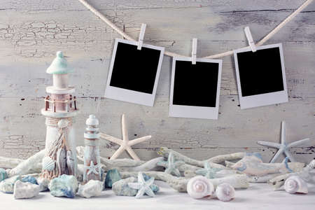 Marine life decoration and  instant photos on a white shabby backgroundの写真素材