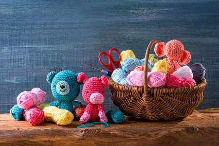 Amigurumi toys on a wooden backgroundの写真素材