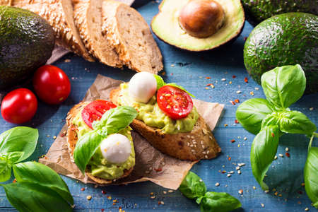 Bruschettas with rye bread, guacamole,tomatoes and mozzarella