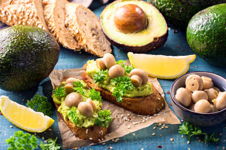 Bruschettas with rye bread, guacamole and champignons