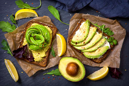 Sandwiches with rye bread, guacamole and fresh avocados