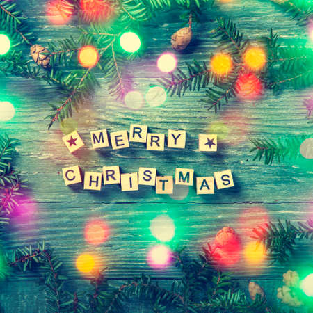 Merry christmas letters on a wooden backgroundの写真素材