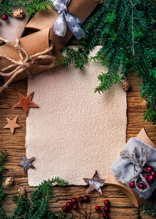 Old parchment for your wishes on a wooden backgroundの写真素材