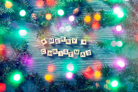 Merry christmas letters on a wooden backgroundの写真素材