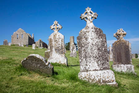 Clonmacnoise Cathedral  with the typical crosses and graves. The monastery ruins. Irelandの写真素材