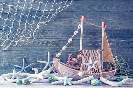 Marine life decoration on a blue shabby backgroundの写真素材