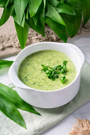 Ramsons cream soup in a white bowl
